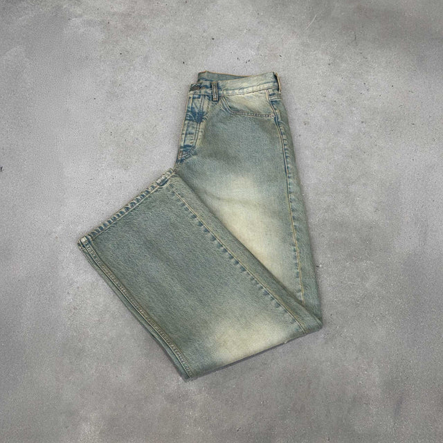Faded Burn Light Blue Loose Fit Jeans.